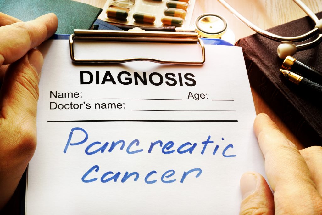 prescription pad with pancreatic cancer written