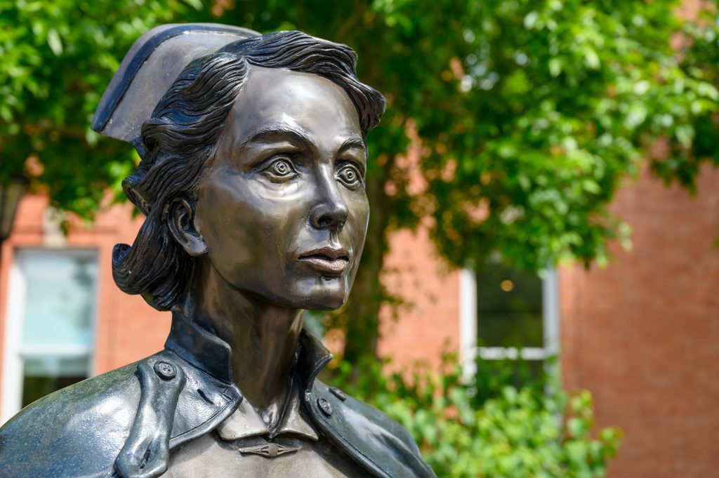 A photo of the Nurse Statue in the garden of the Galt Museum & Archives.